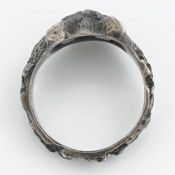 Ring in the form of an owl, silver with orange stone.