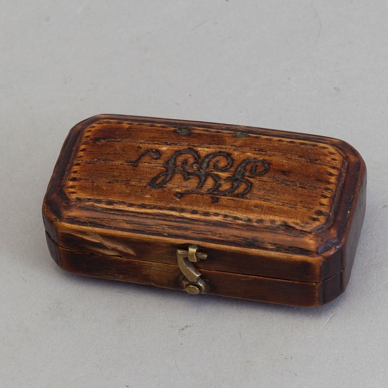 A brass and iron phleam dated 19th century.