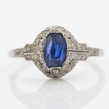 Ring 14K gold with a synthetic blue stone and small diamonds and white stones.