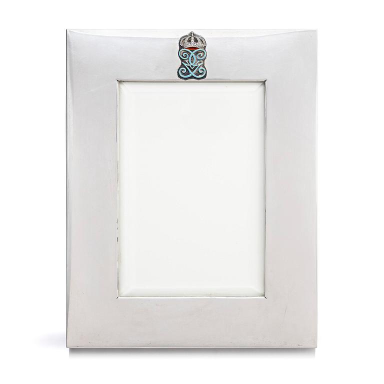 A silver and enamel frame with glass, mark of CG Hallberg, Stockholm 1937.