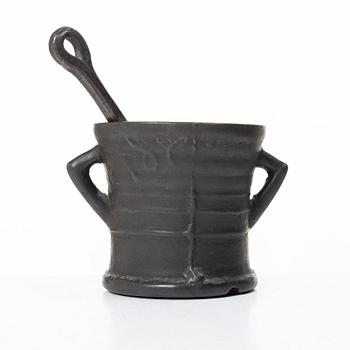 Mortar and pestle, dated 1673.