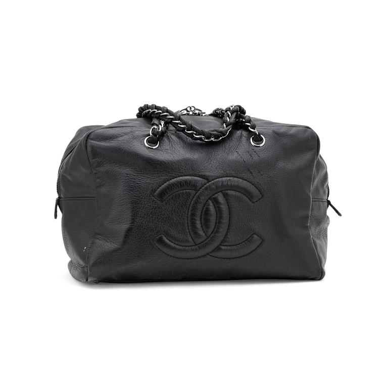 CHANEL, a black leather shoulder bag.