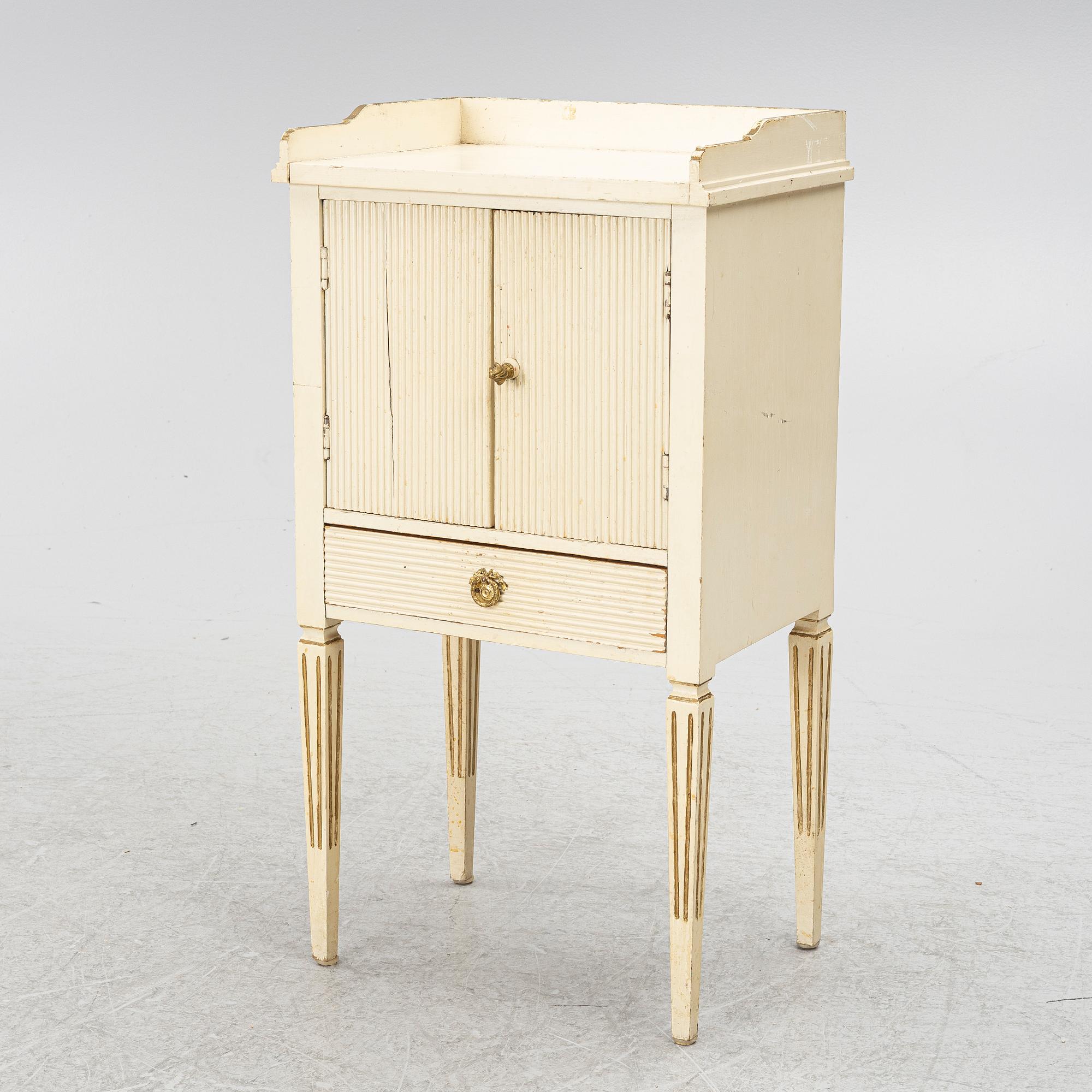 A Gustavian style bedside table, early 20th century.