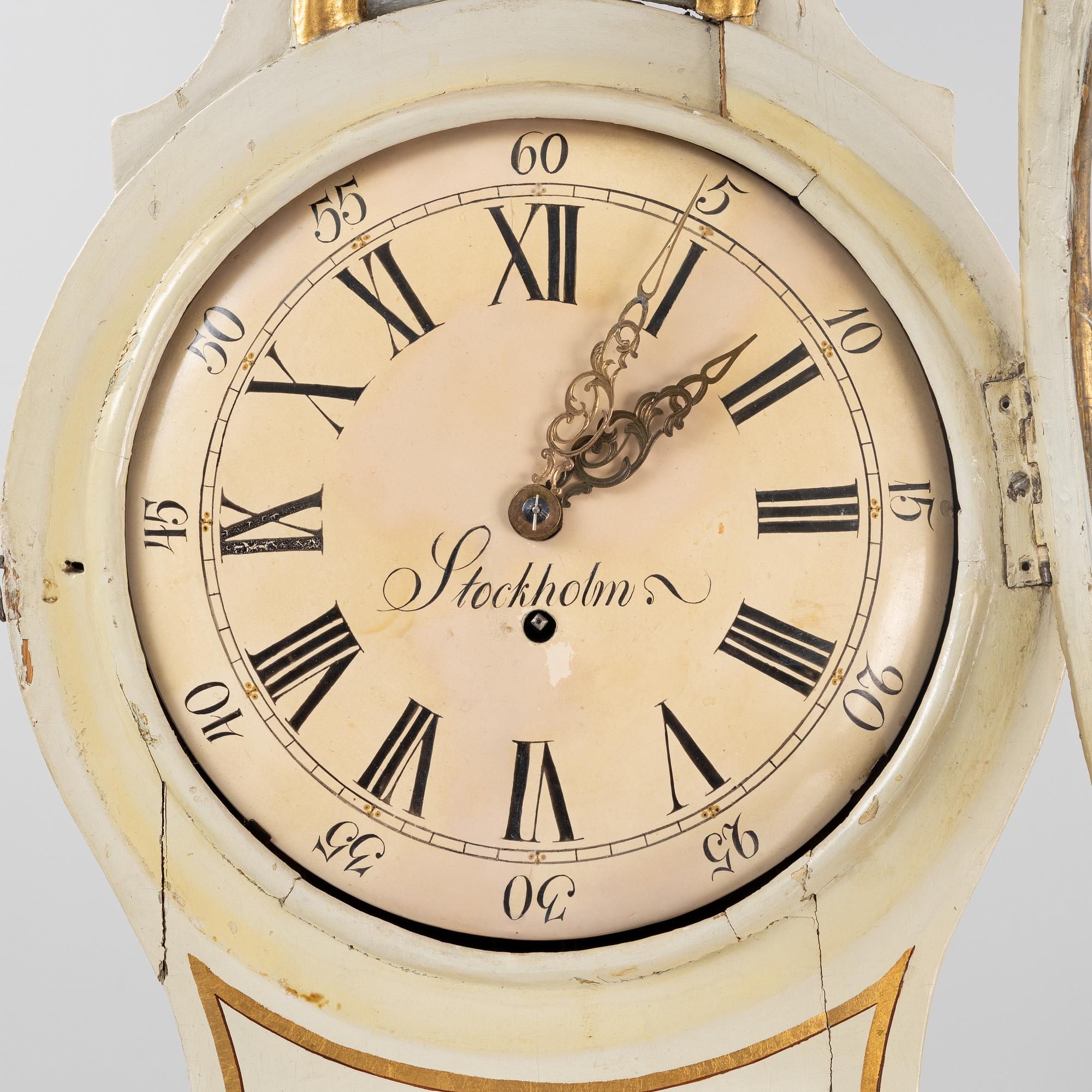 A long-case clock, 19th century.