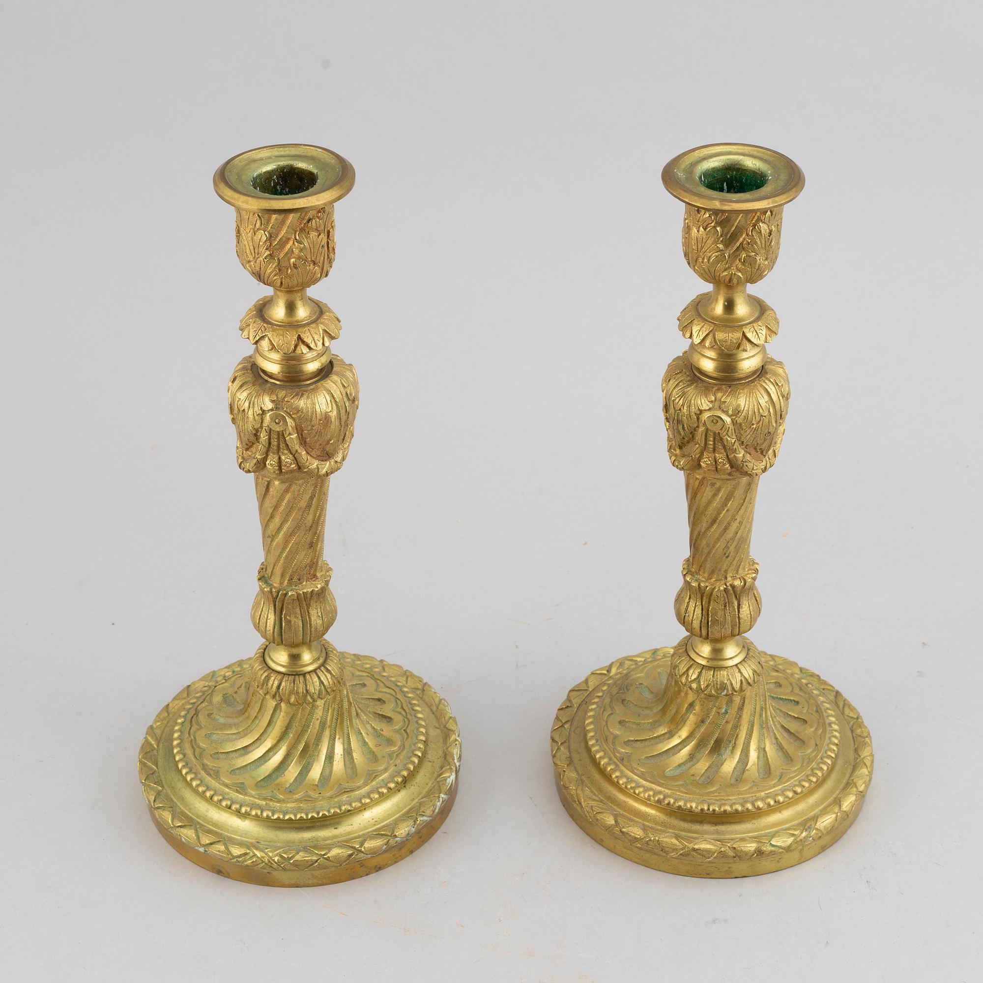 A pair of bronze Louis XV-style candlesticks, circa 1900.