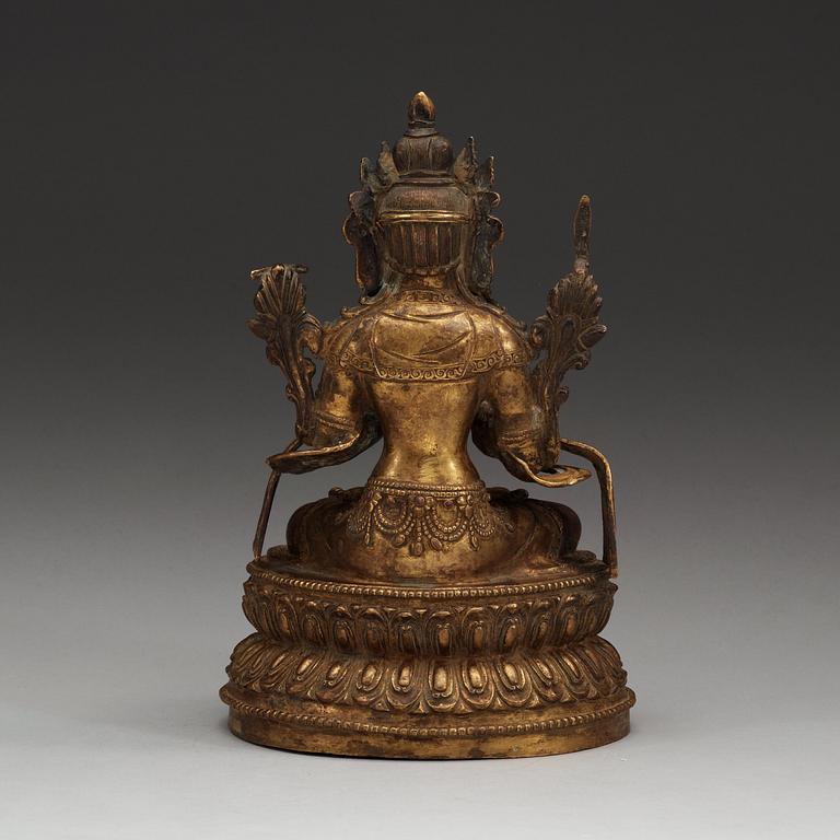 A gilt bronze and jeweled figure of Manjusri, with Yongle six character mark.