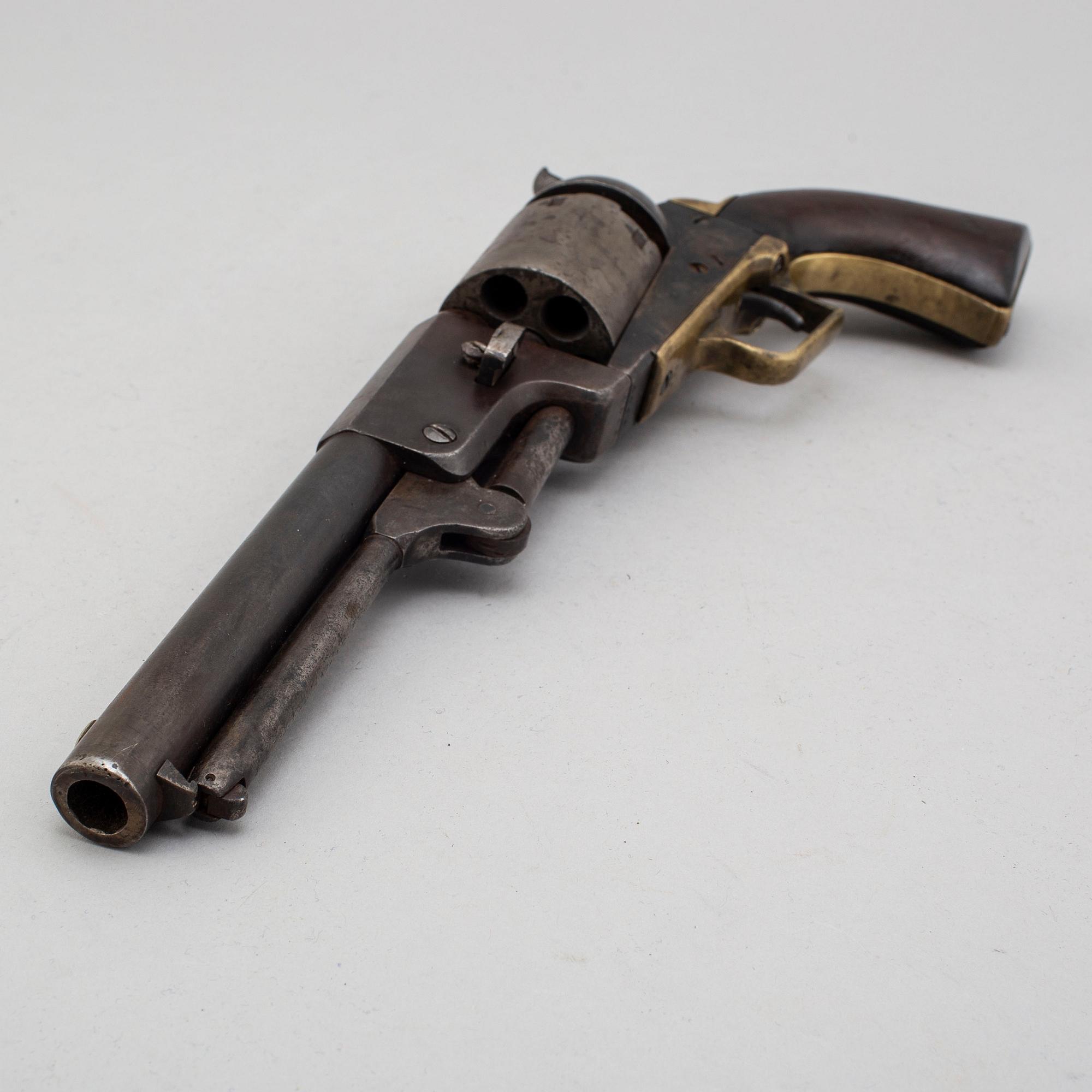 A Colt Dragoon percussion revolver no 9344 manufactured 1850.