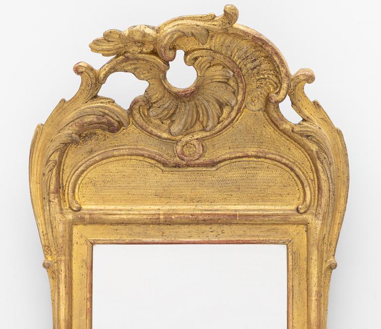 A giltwood rococo mirror, Stockholm, later part 18th century.