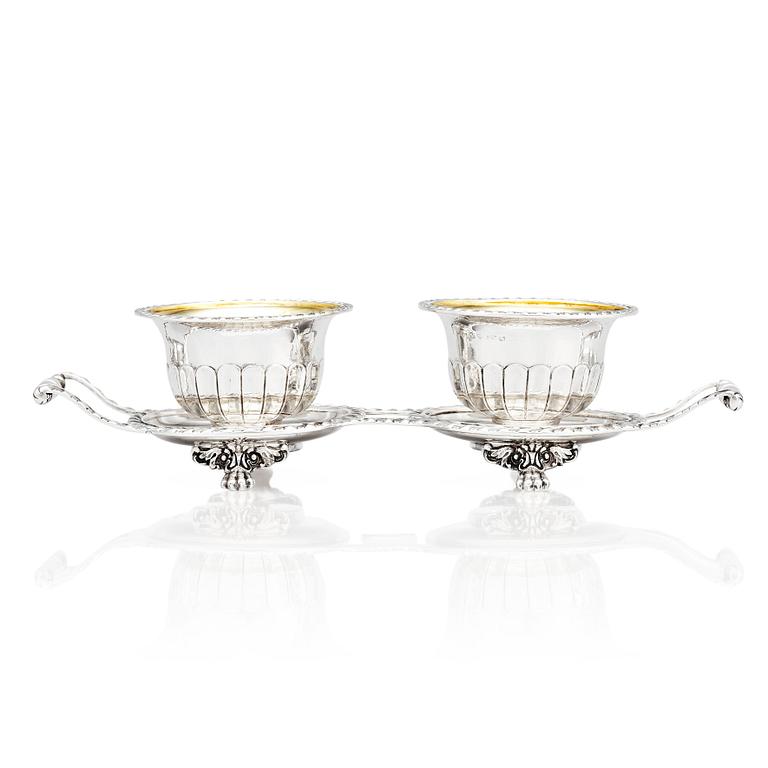 A pair of Swedish candy bowls with stand, parcel-gilt silver, mark of Gustaf Möllenborg, Stockholm 1851.