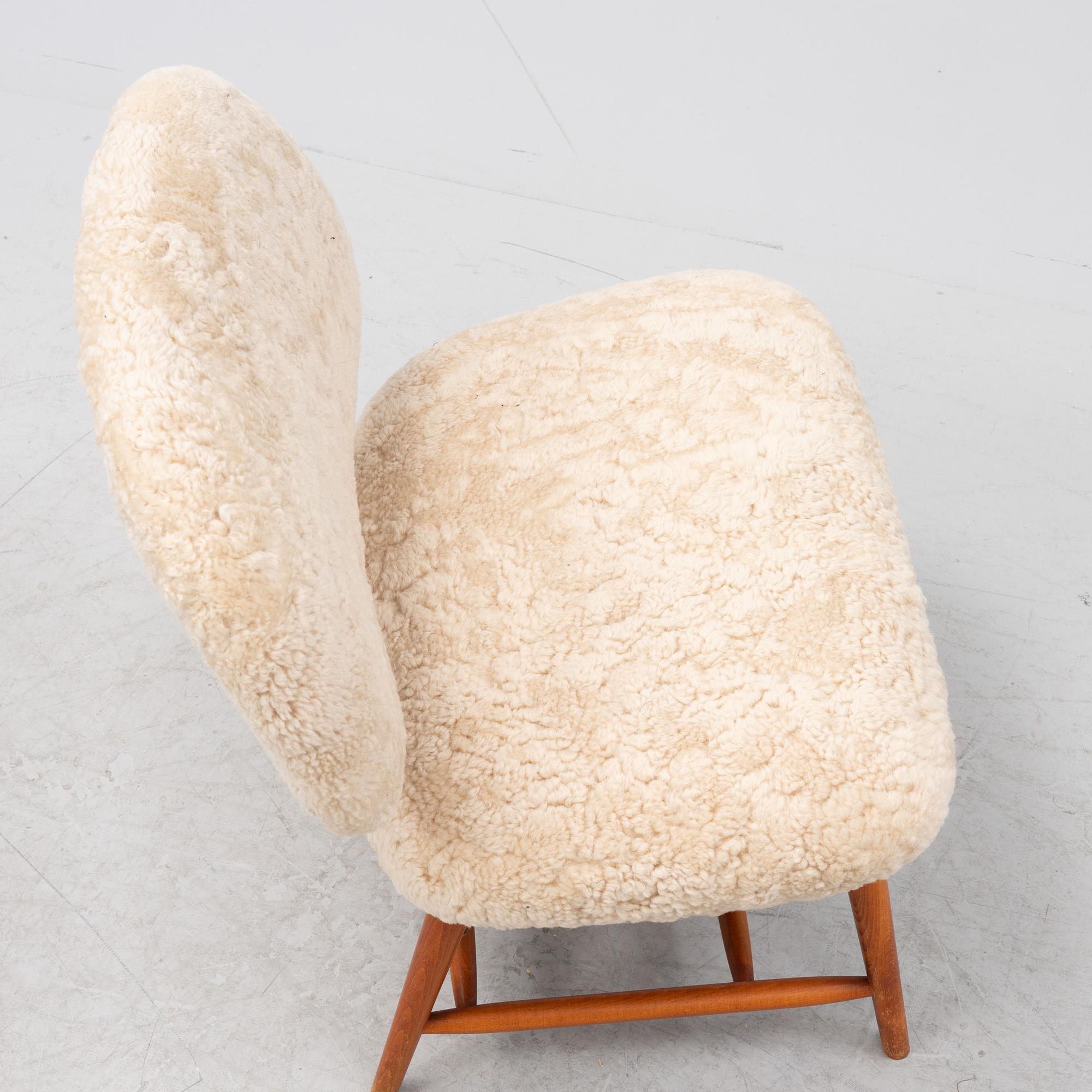A TeVe easy chair by Alf Svensson, with new sheepskin upholstery, Studio Ljungs Industrier, 1950's.