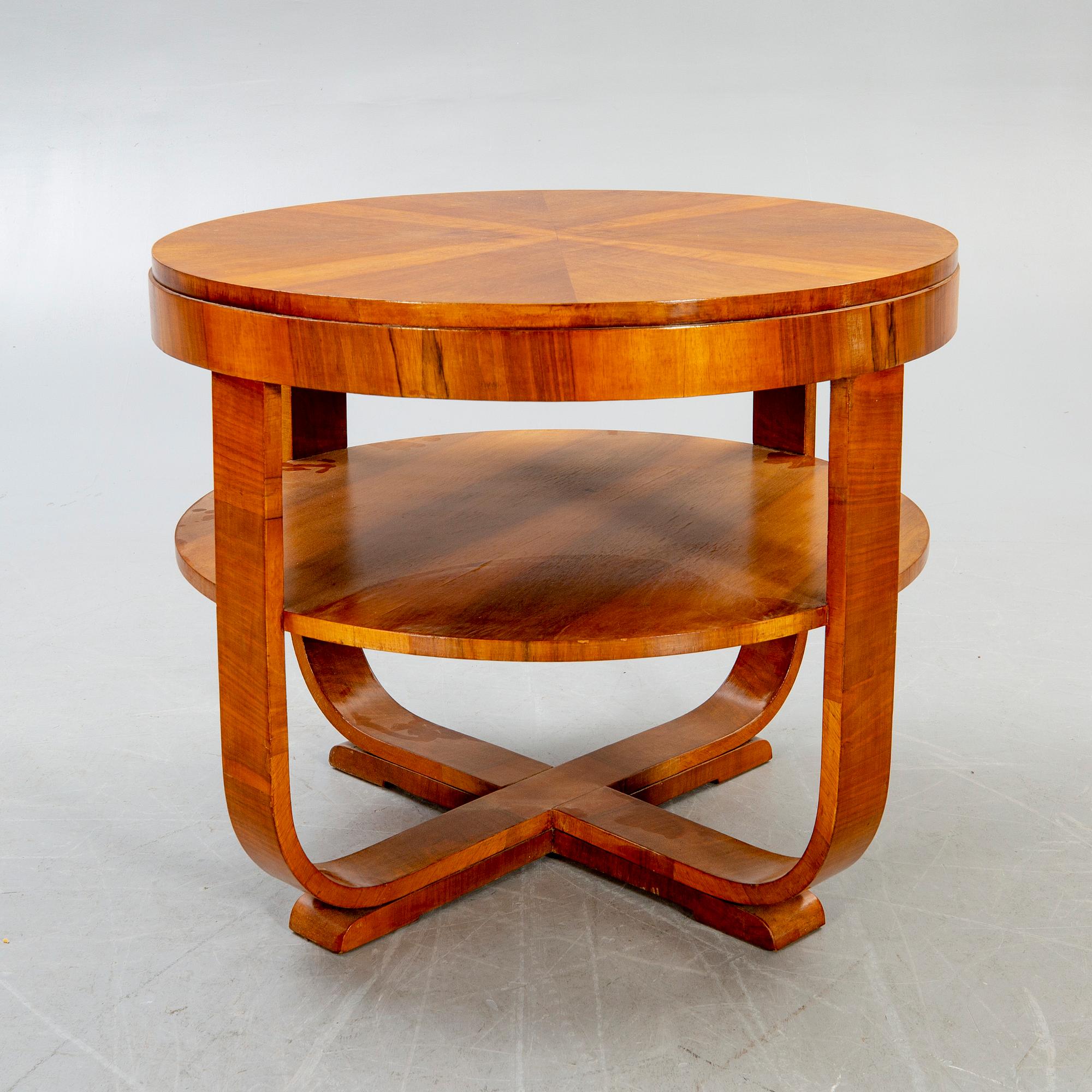An Art deco style walnut coffee table alter part of the 19th century.