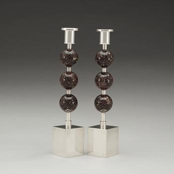 A pair of Sigurd Persson silver plated and porphyry candlesticks, Sweden.