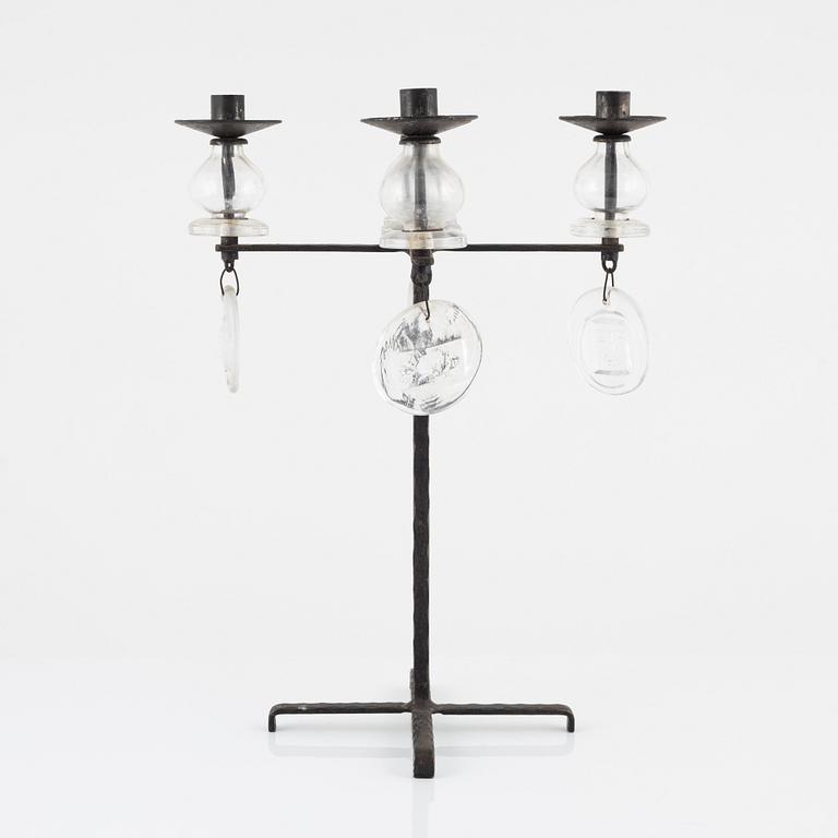 Erik Höglund, a iron and glass candelabra.