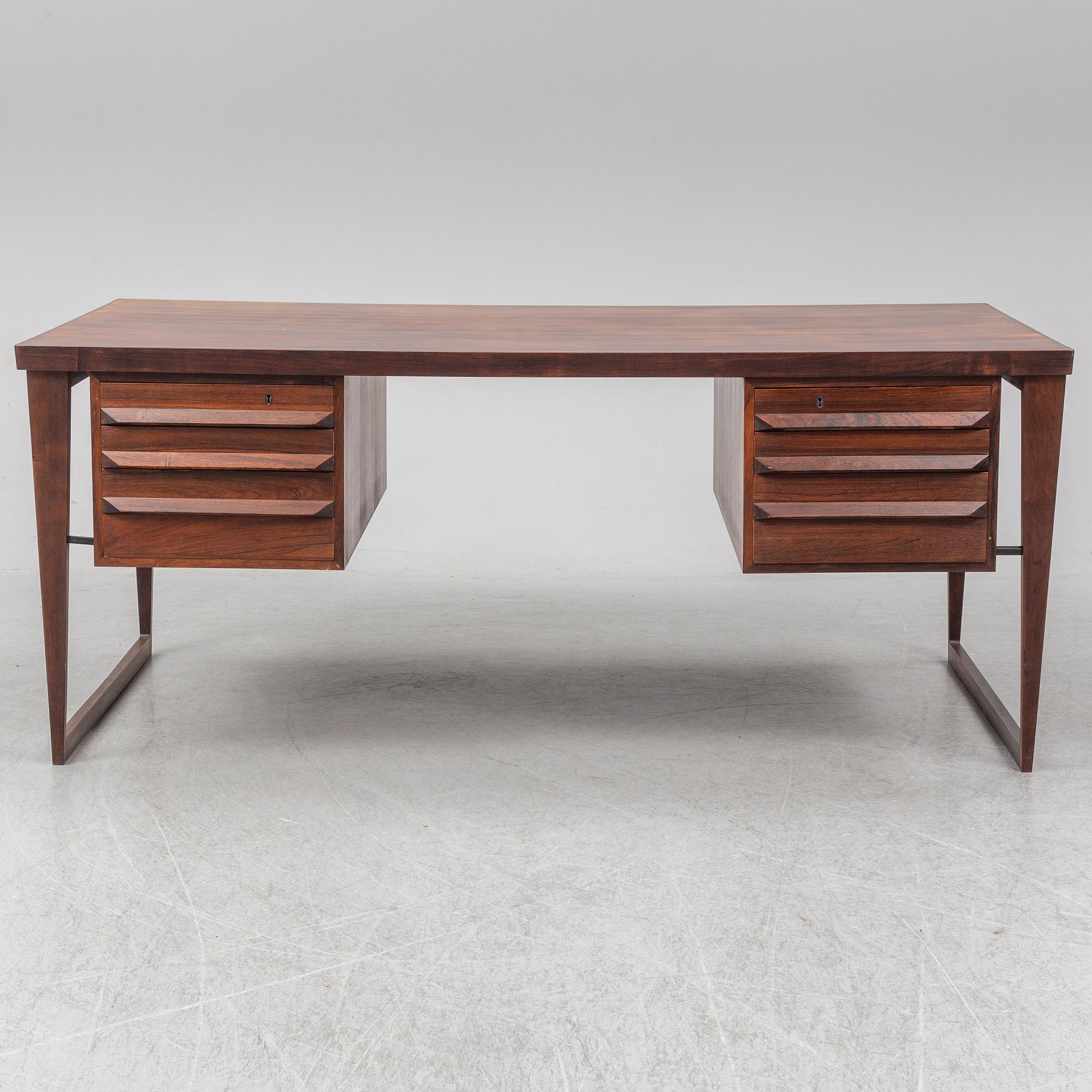 A 1960's rosewood desk by Kai Kristiansen, Feldballes Møbelfabrik, Denmark.