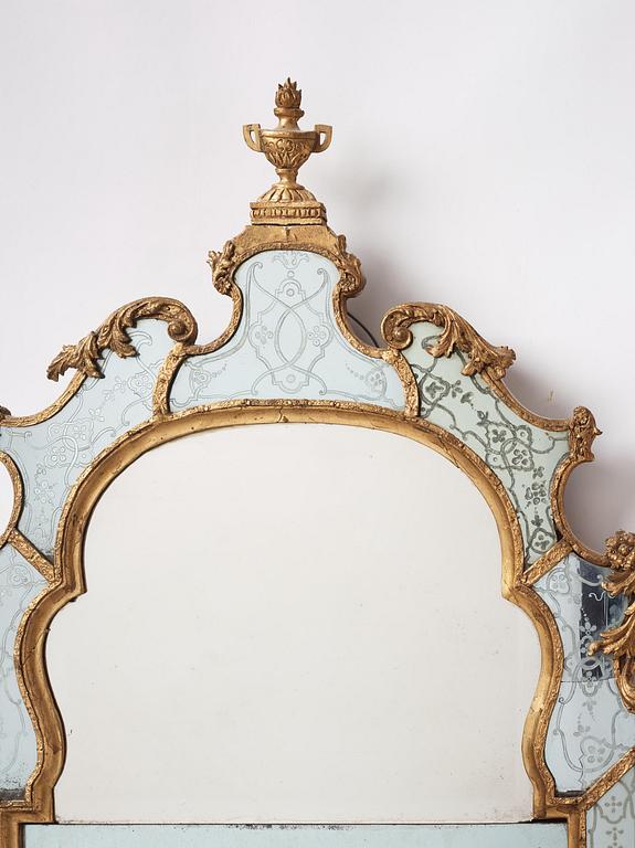 A Baroque gilt-lead and engraved glass mirror in the manner of Burchard Precht, early 18th century.