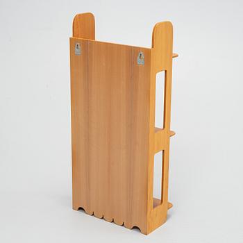 Josef Frank, a model 2085 wall shelf for Firma Svenskt Tenn.