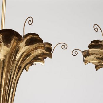 A.W. Borgh, a pair of Swedish Grace brass chandeliers, probably 1920-1930's.