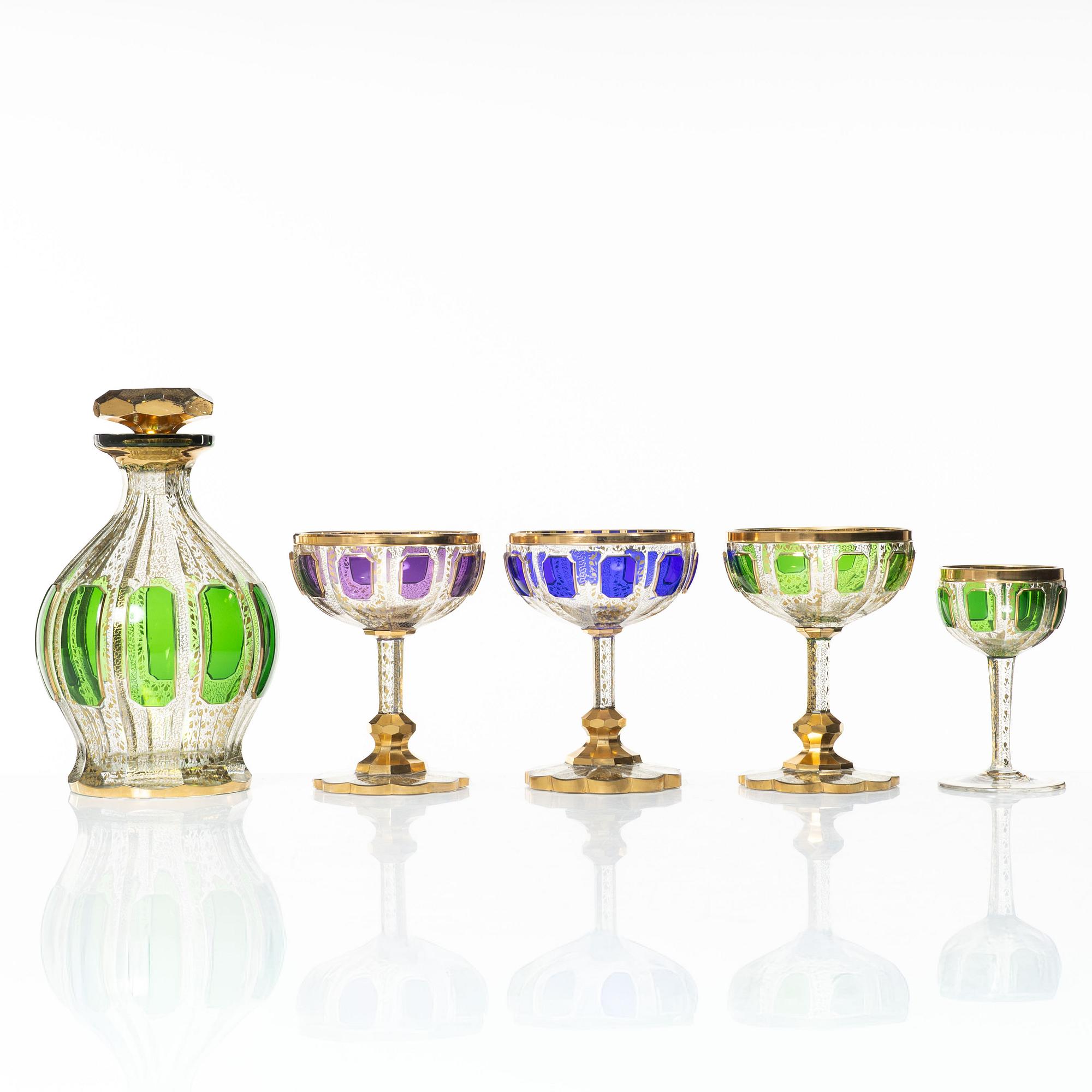 A cut, gilded and coloured glass service, 20th century. (19 pieces).