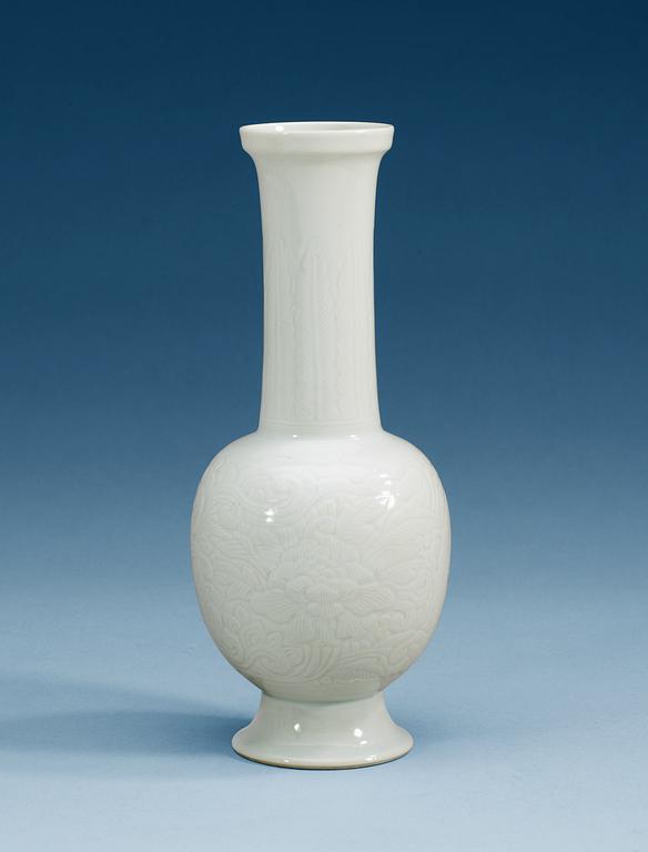 A white glazed vase, Qing dynasty with mark.