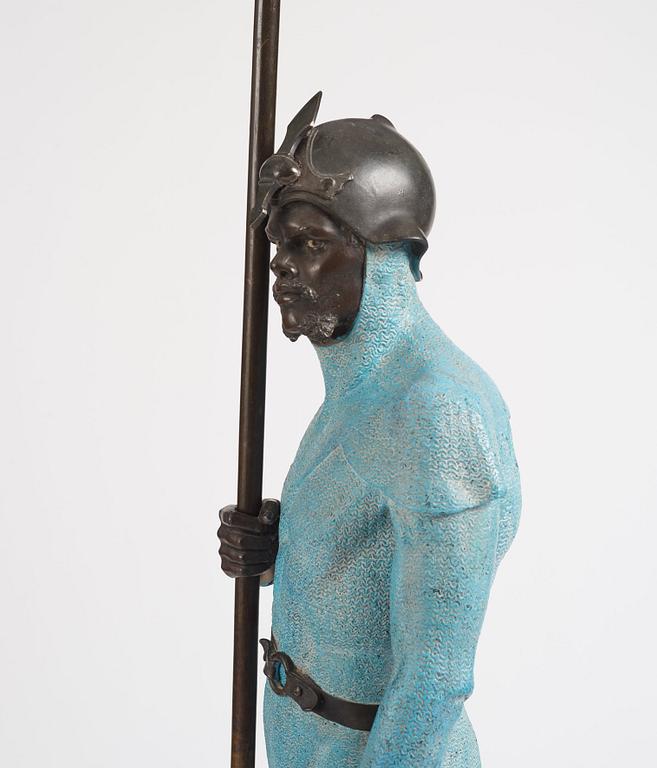 A bronze sculpture of a man in armour, late 19th century.