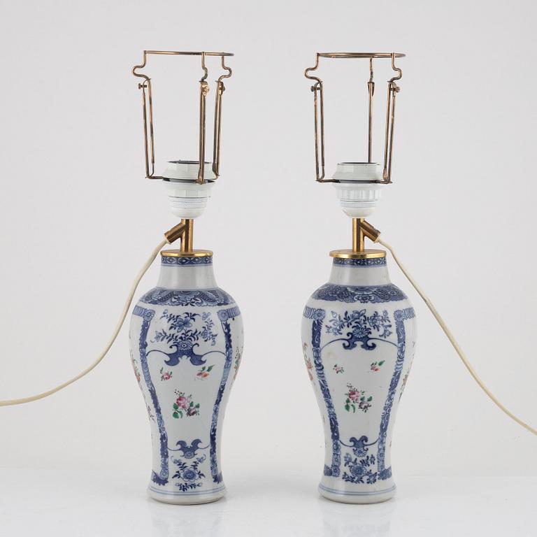 A pair of Chinese porcelain table lights/vases, 18th Century.