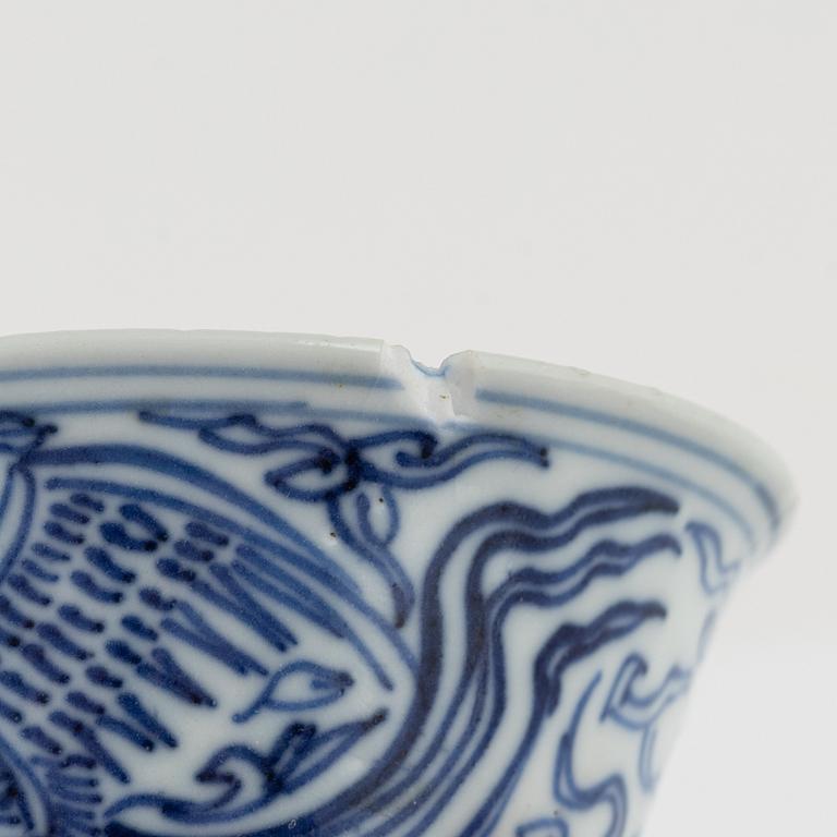 a pair of blue and white cups and three dishes, China, late Qing dynasty.