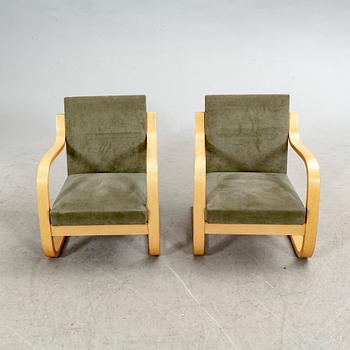 Alvar Aalto, a pair of birch armchairs model nr 402 21st century.