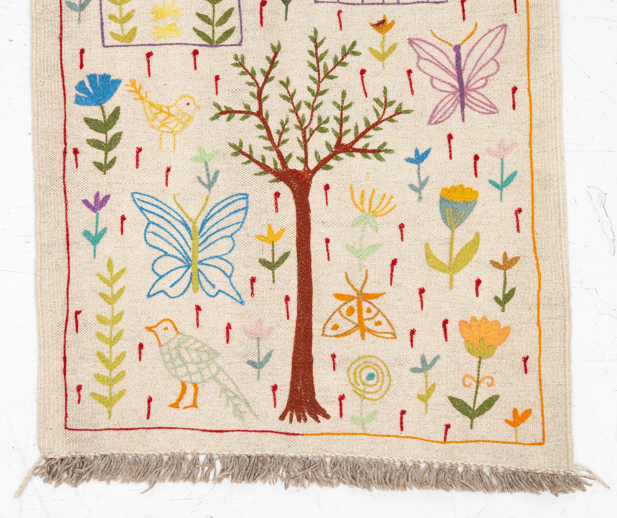 A hand-embroidered kilim runner, c. 300 x 80 cm.