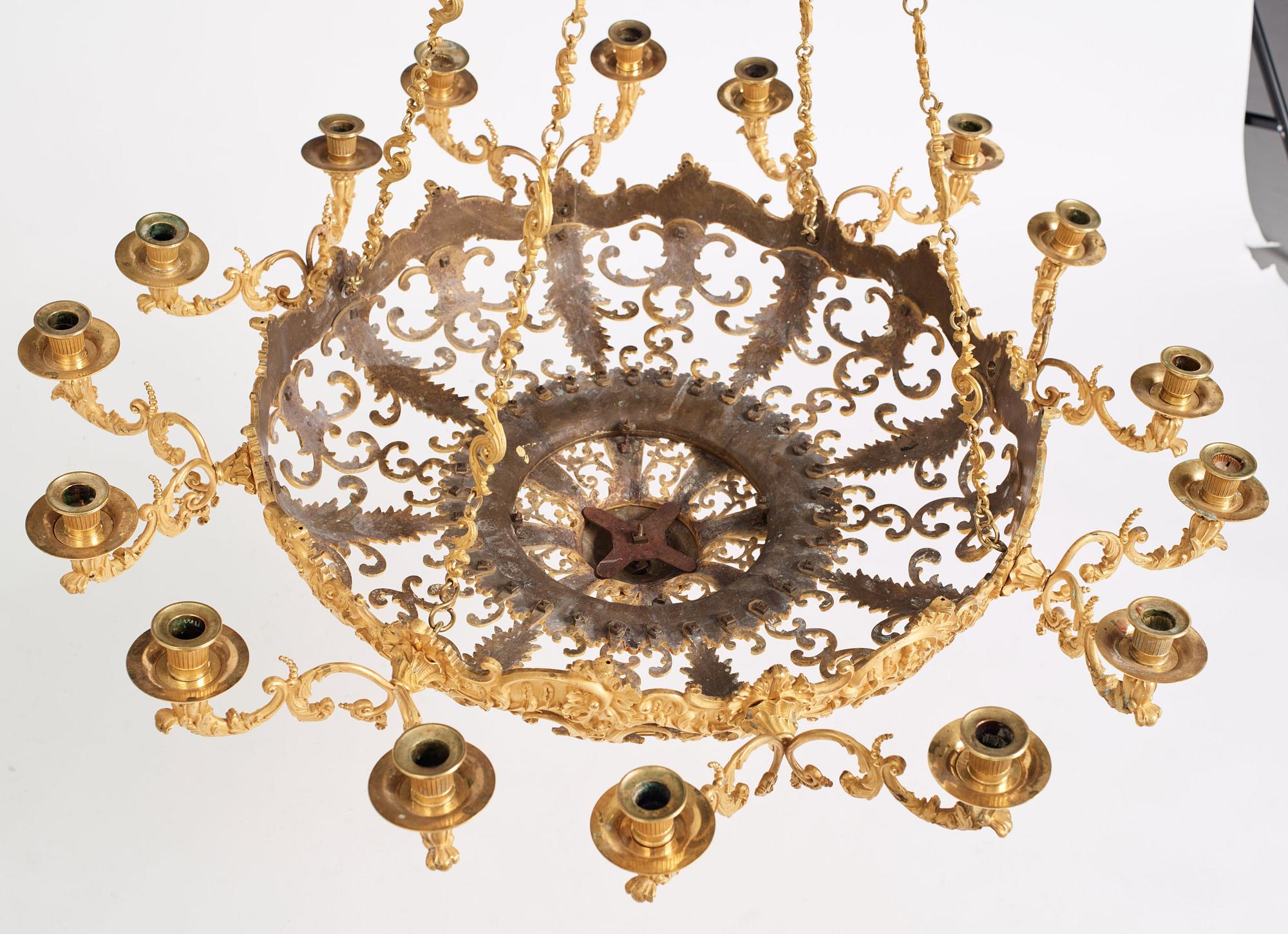 A rococo-revival gilt-brass sixteen-light chandelier, mid 19th century.