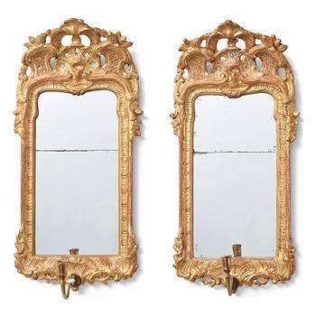 107. A pair of Swedish Rococo 18th century one-light girandole mirrors.