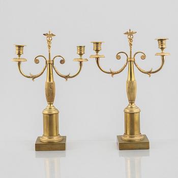 A pair of brass candelabra, first half/mid 19th century.