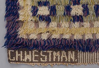 A CARPET, knotted pile, ca 225 x 138 cm, signed GH.WESTMAN, attributed to Hans (Gustaf) Westman.