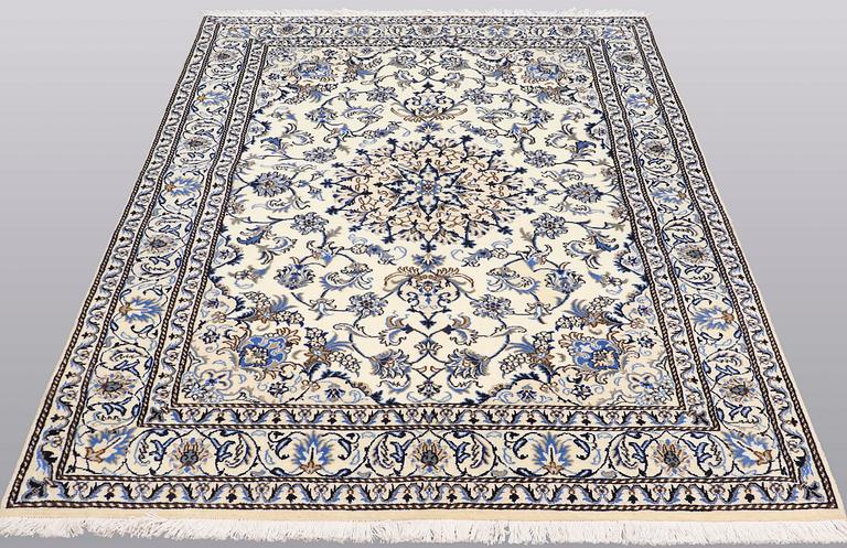 A rug, Nain part silk, ca 235 x 160 cm.