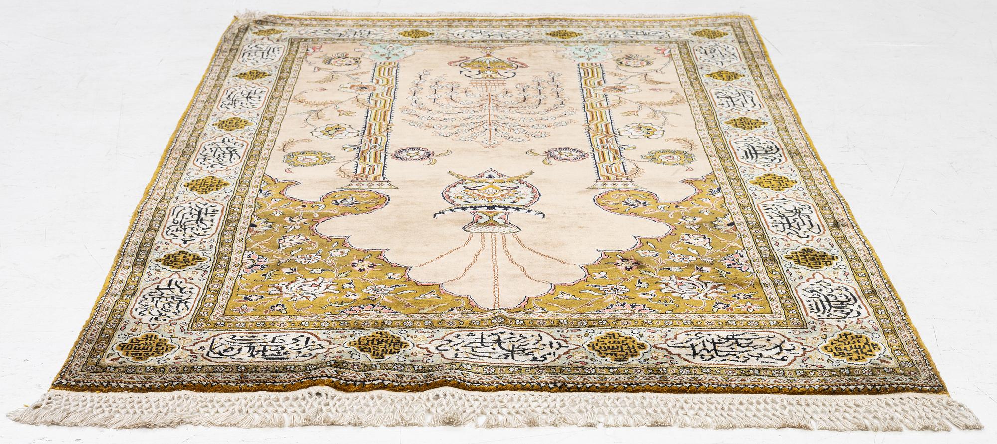 A silk Quum rug, c. 155 x 103 cm.