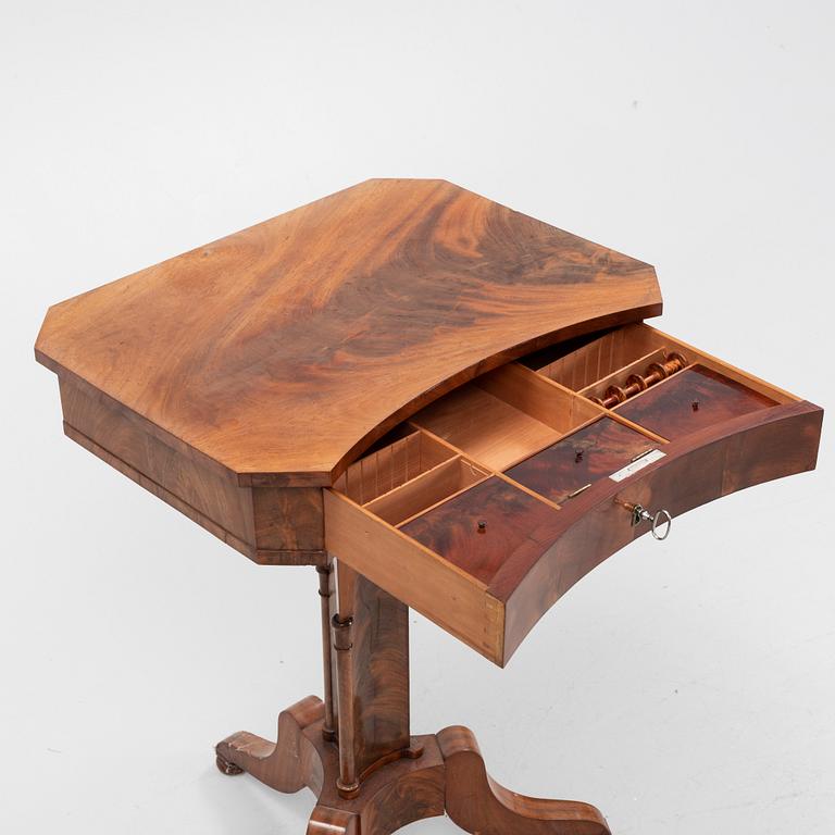 A mid 19th century mahogany work table.