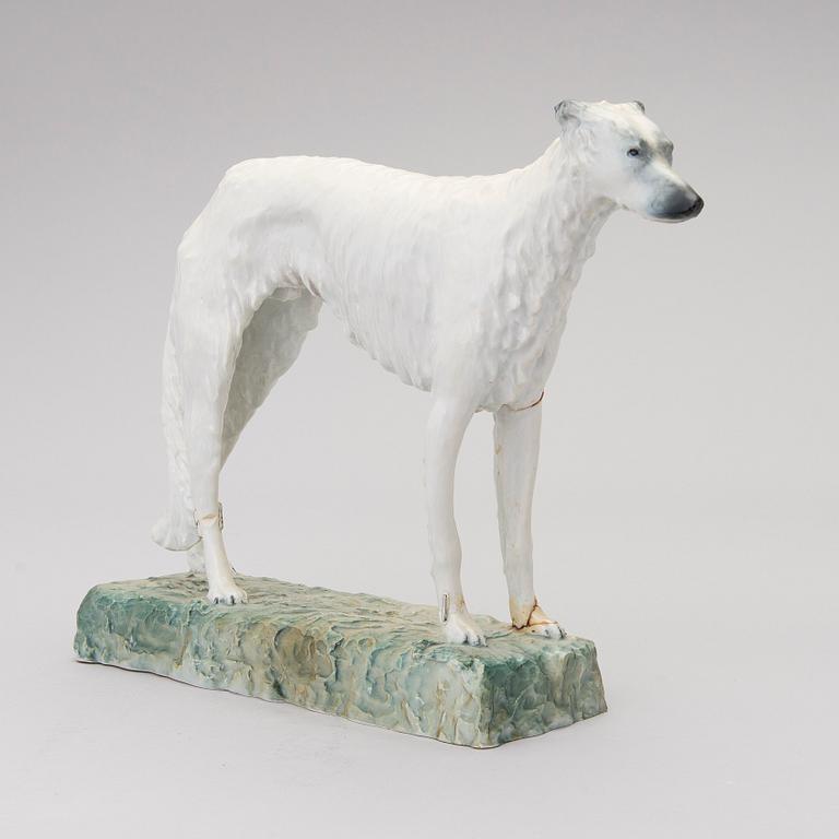 A porcelain borzoi figurine from Arabia Finland, signed and dated -30.