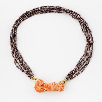 Multi-strand pearl necklace with two clasps set with carved coral, cabochon-cut tourmaline, and brilliant-cut diamonds.