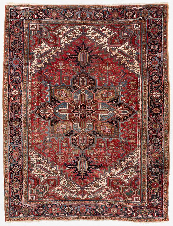 A semi-antique Heris carpet, west persia c. 322 x 252 cm.