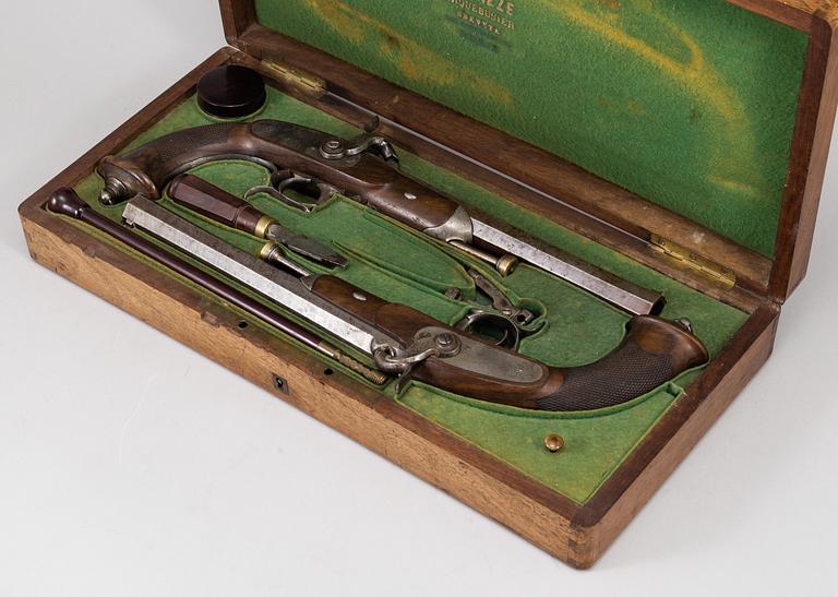 A 1840's French cased percussion pistols marked: Mre Rle de Maubeuge.