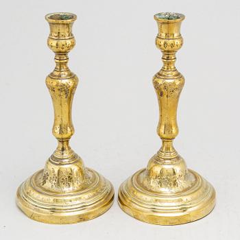 A pair of 18th century Louis XV bronze candlesticks.