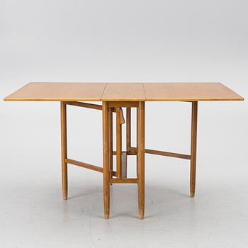 A mid20th century gate-leg table.