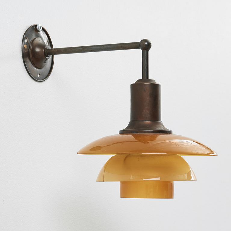 Poul Henningsen, a 'PH-2/2' wall lamp with amber coloured glass shades, Louis Poulsen, Denmark 1930's.