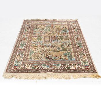 An oriental, figural rug, signed, c. 220 x 145 cm.