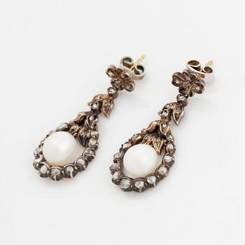 A pair of silver and gold earrings set with pearls and rose-cut diamonds.