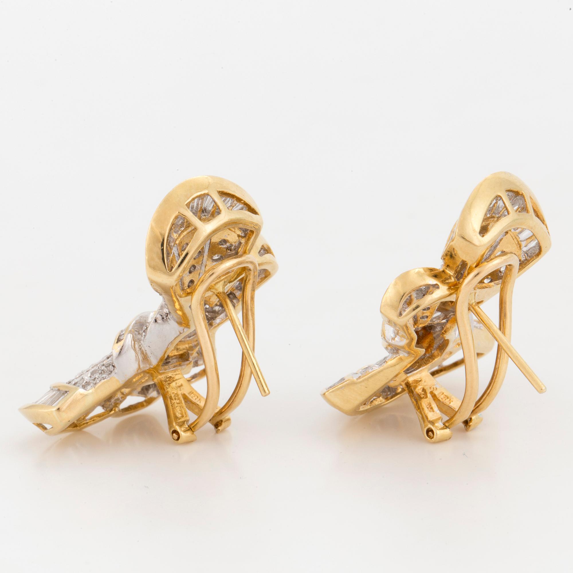 A pair of earrings in the shape of bows set with round, brilliant and tapered, baguette-cut diamonds.