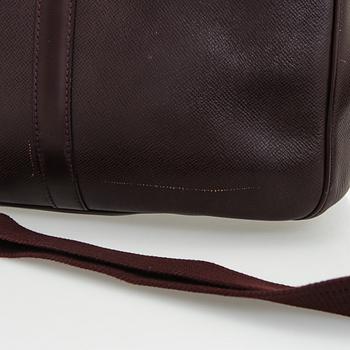 Louis Vuitton, a 'Taiga Kendall PM' weekend bag.