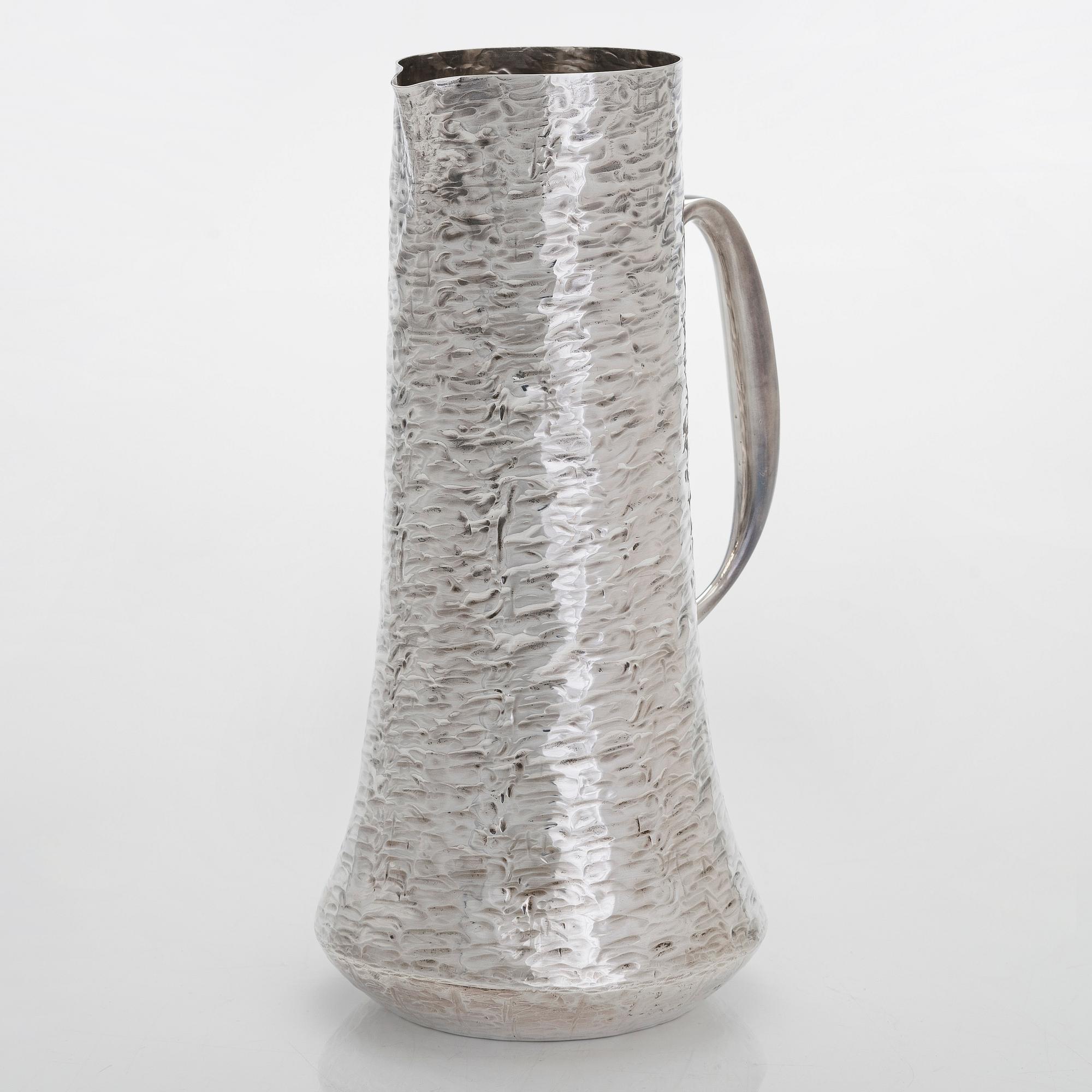 Tapio Wirkkala, a sterling silver pitcher with eight beakers, Hämeenlinna Finland 1973-1978.