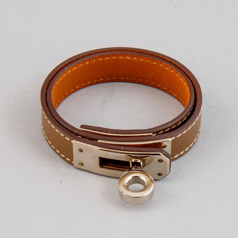 Hermès, a taupe leather 'Kelly Double' bracelet, size XS, 2013.