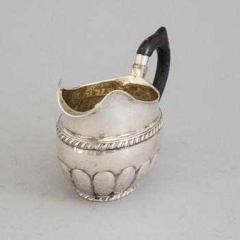 A RUSSIAN SILVER CREAM JUG, maker's mark Erik Frisk, St petersburg, 1825.