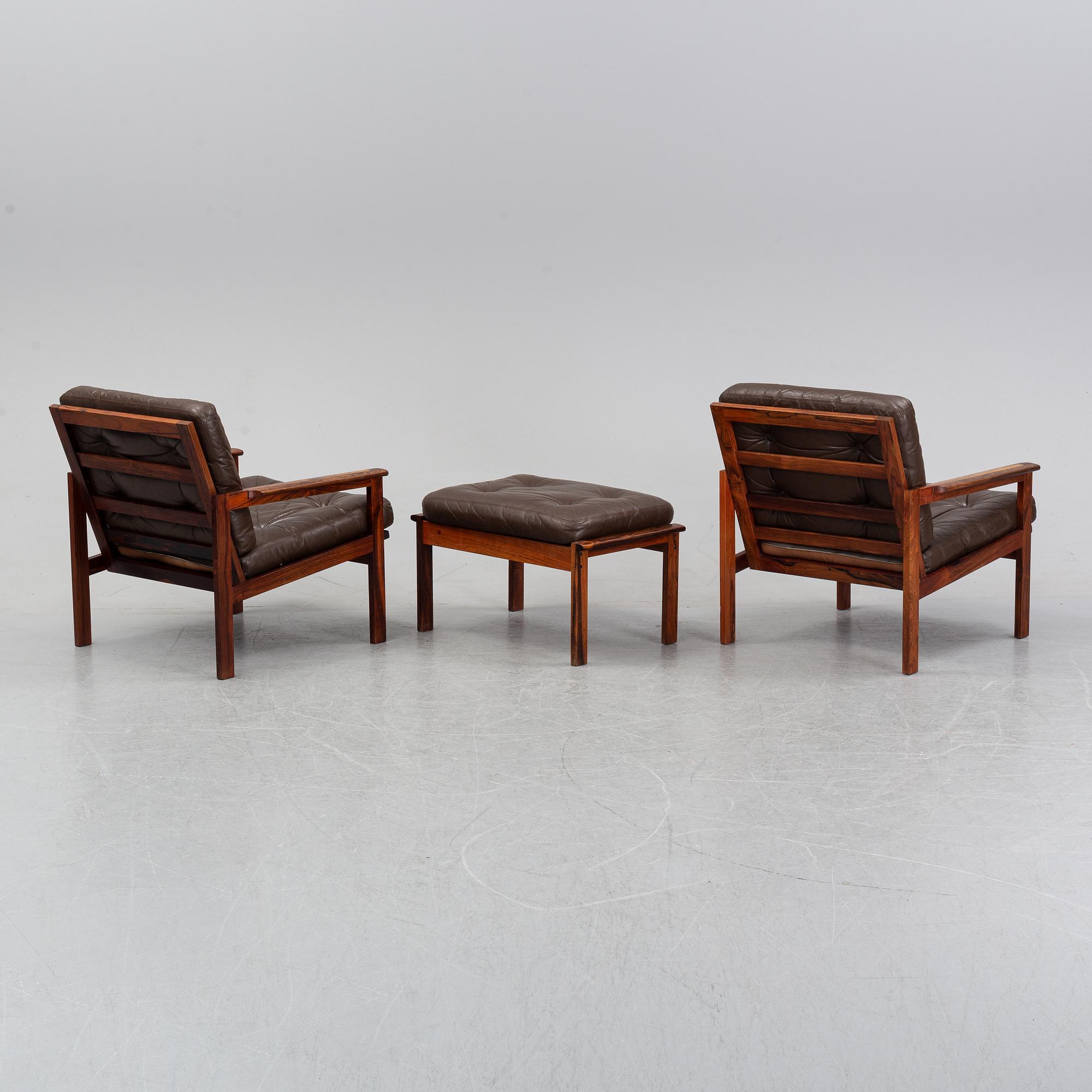 Illum Wikkelsö, a pair of 'Capella' easy chairs and one stool. Eilersen, Denmark. Designed 1959.